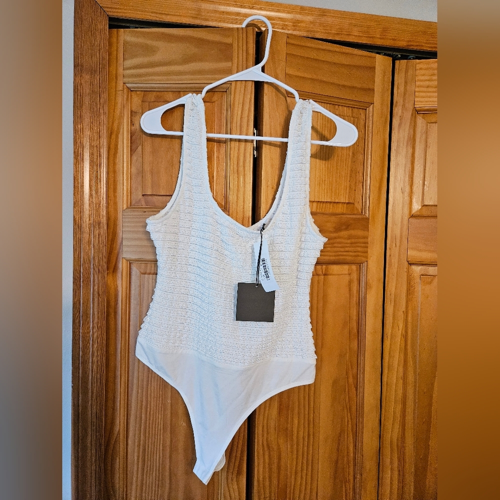 NWT white ruffle scoop neck/back bodysuit. Size Large